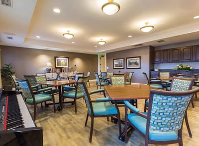 Bright common area with colorful chairs and tables