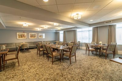 Bright dining area with tables and chairs