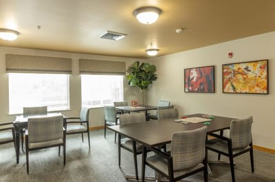 Bright common area with seating and artwork