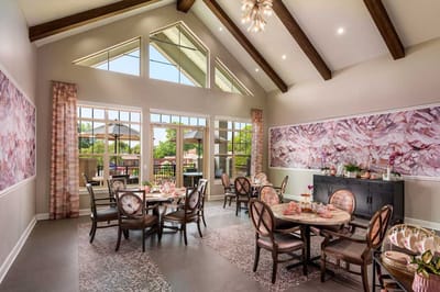 Bright dining room with tables set for a meal