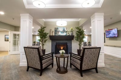 Comfortable seating area with a fireplace in the common area