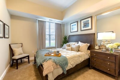 A cozy private resident room with a bed and window