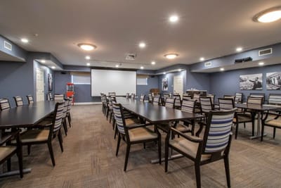 Interior view of a large activity room with tables