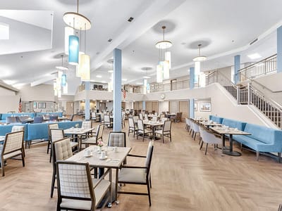 Spacious dining room with tables and decorative lights