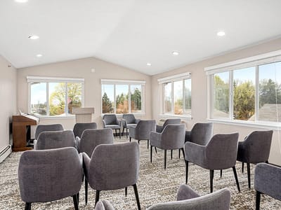 Bright common area with seating and large windows