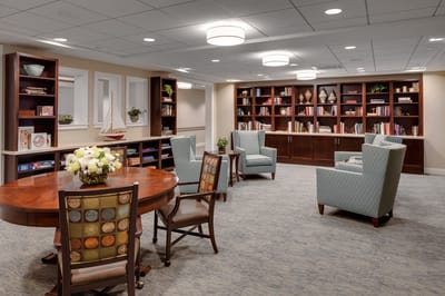 Common area with bookshelves and seating