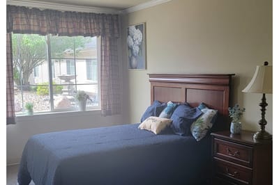 Cozy private bedroom with a window view
