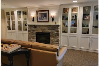 Cozy common area with a fireplace and bookshelves
