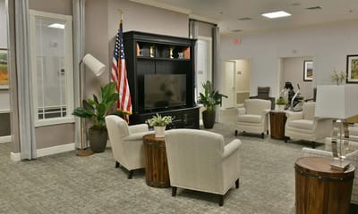 Comfortable lounge area with armchairs and American flag