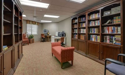 Cozy interior room with bookshelves and seating