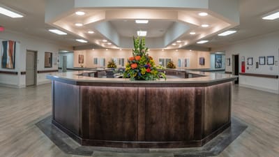 Bright and welcoming lobby area with floral arrangements