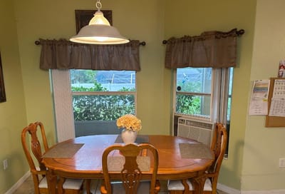 Cozy dining area with table and flowers