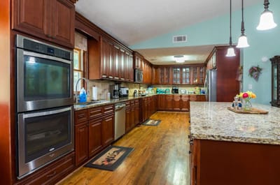Bright kitchen with wooden cabinets and granite countertops