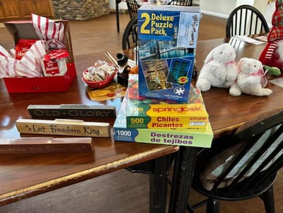 Board games and decorative items on a table in a common area