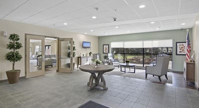 Bright interior common area with seating and greenery