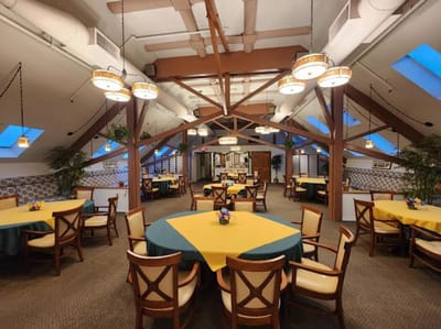 Bright dining area with tables and chairs