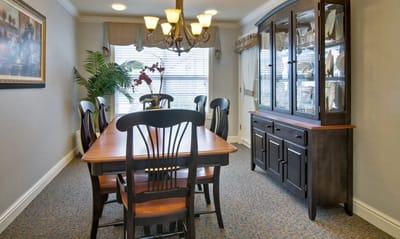Dining room with a large wooden table and chairs