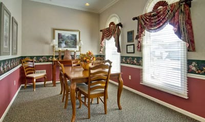 Cozy dining area with floral decor and wooden furniture