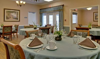 Well-set dining room with tables arranged for a meal