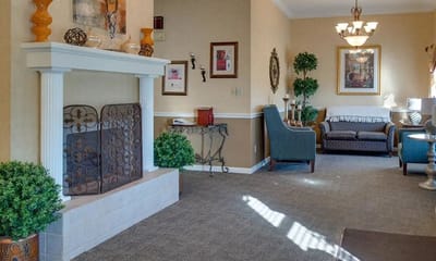 Interior view of a common area with a fireplace and seating