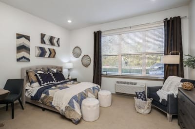 A well-decorated private resident bedroom with natural light