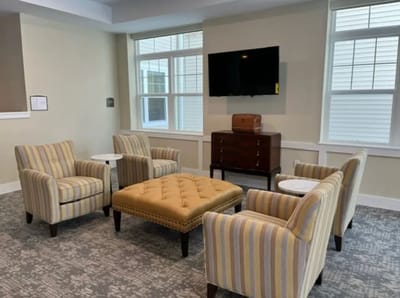 Cozy common area with seating and a television