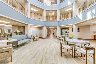 Bright common area with seating and flowers