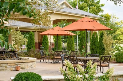Outdoor seating area with umbrellas and landscaping