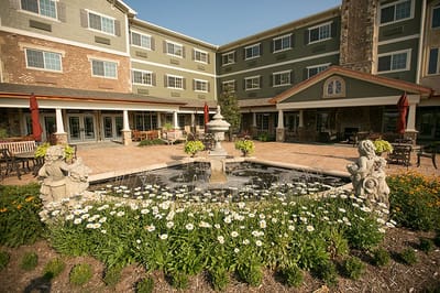 Outdoor space with fountain and flowers