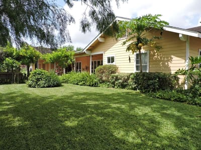 Exterior view of a senior living facility with landscaping