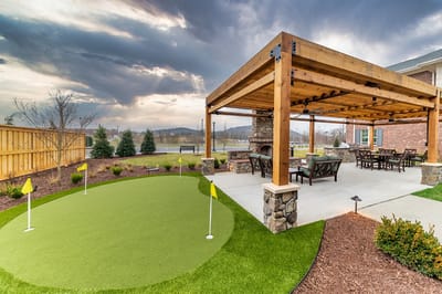 Outdoor area with putting green and seating