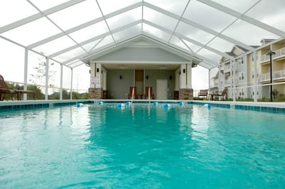 A pool area under a screened enclosure