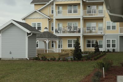 Exterior view of The Carriage House with gardens