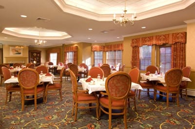Elegant dining room with round tables and floral decor