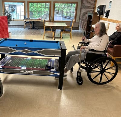 Residents engaged in a game in the common area
