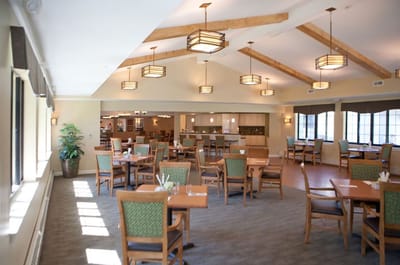Bright dining room with wooden beams and tables