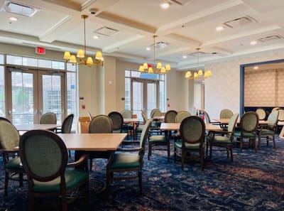 Dining area with tables and chairs in the facility