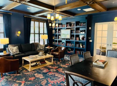 Cozy common area with bookshelves and seating