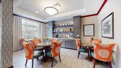 Bright common area with colorful chairs and decor