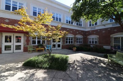 Outdoor courtyard with seating and garden features