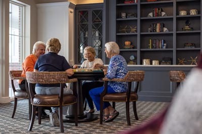 Residents enjoying a game in a common area