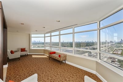 Bright common area with large windows and city view