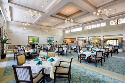 Dining room setting with tables and flowers