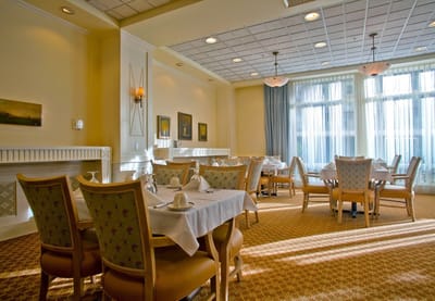 Bright dining area with tables set for meals
