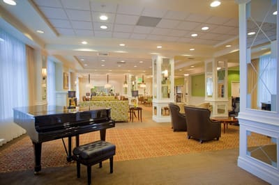 Bright common area with a piano and seating