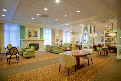 Bright common area with seating and artwork
