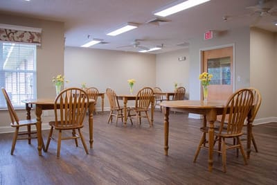 Common area with wooden tables and chairs