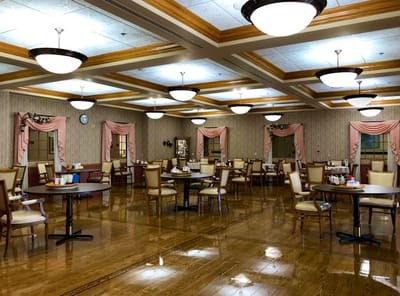Dining area with tables and chairs in a bright room