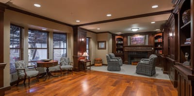 Interior common area with seating and a fireplace