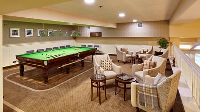 Common area with a billiards table and seating